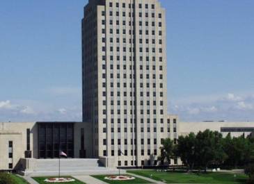 Flowerbed-Approved design Sept. 1980; May 1981 1st yr flowers spell out ND, red/white petunias.