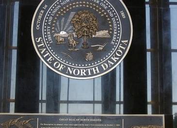 ND Great Seal-A relief metal casting 6' diameter weighs over 400 lbs; plaque below seal is 500 lbs.