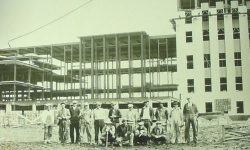 Men standing in front of capitol building contruction